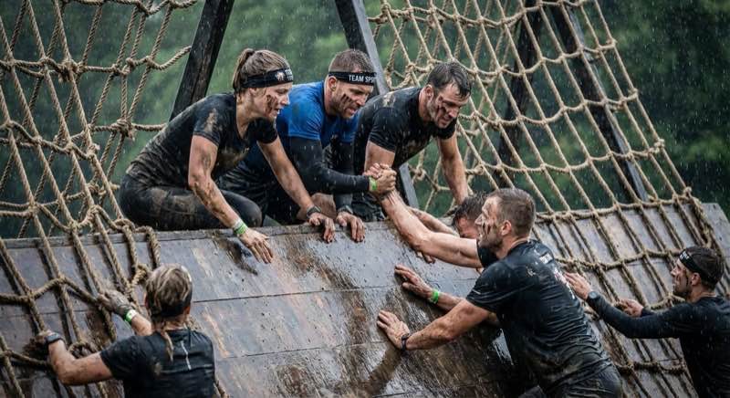 Runners competing in a obstacle event